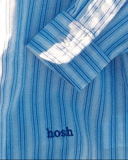 Blue striped shirt with 'hosh' branding on a white background